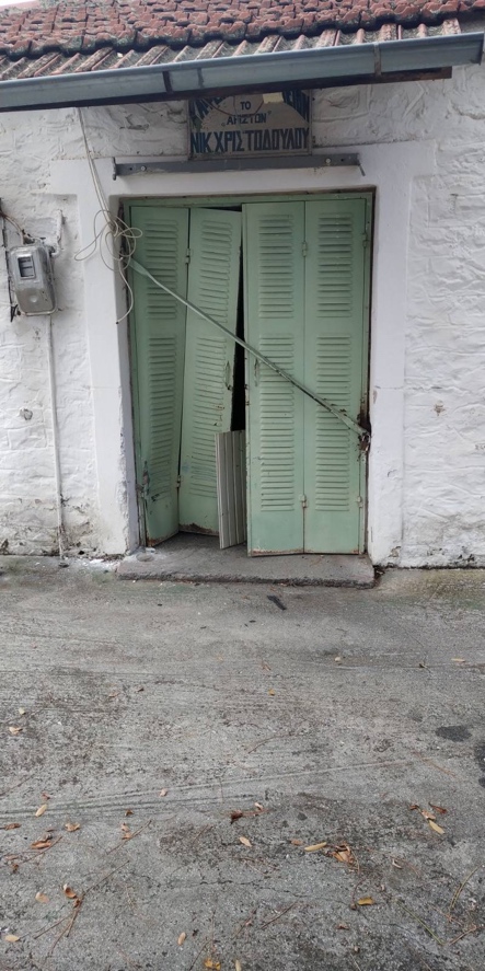 A door with shutters on it

Description automatically generated